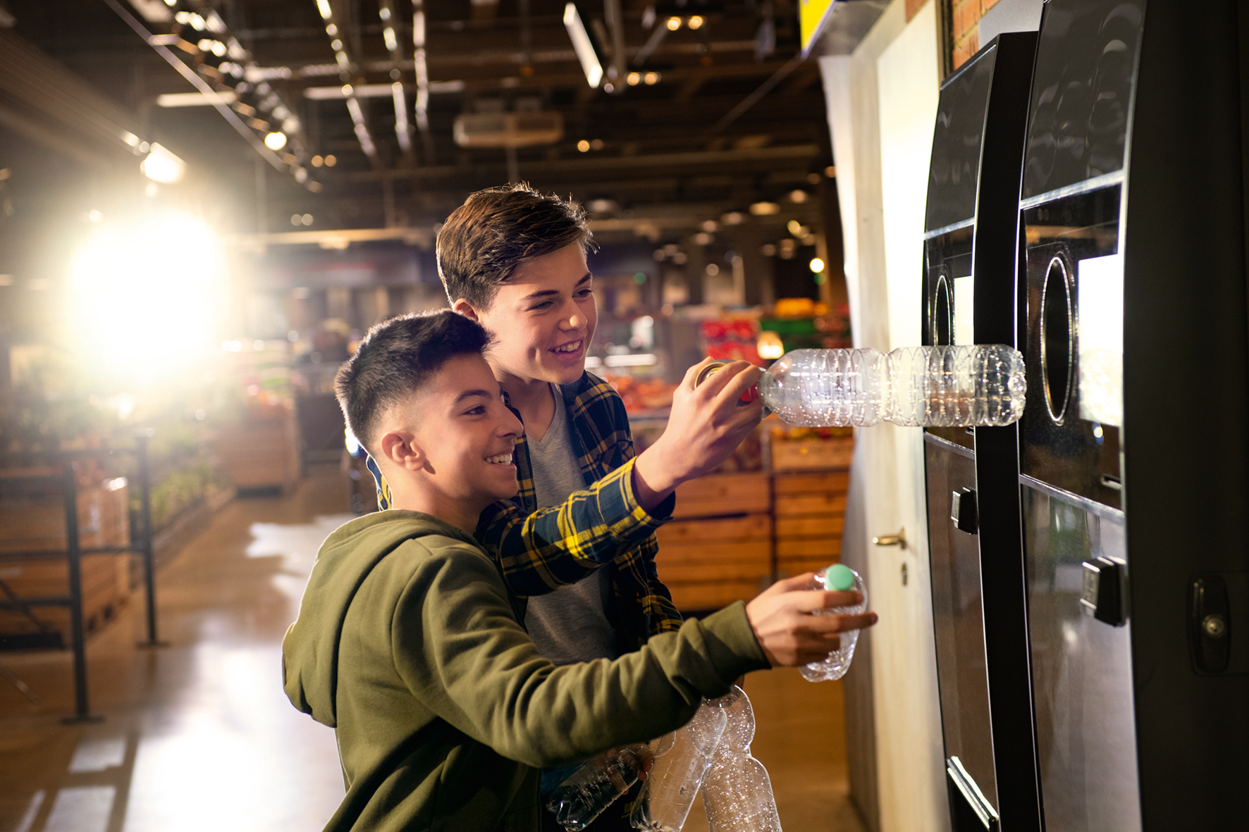 image of kids with reverse vending machines
