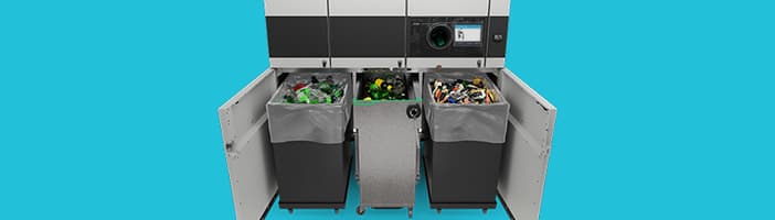 Open TOMRA T70 TriSort reverse vending machine with a mix of recyclables