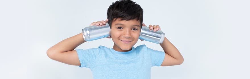 Boy holding cans up to his ears